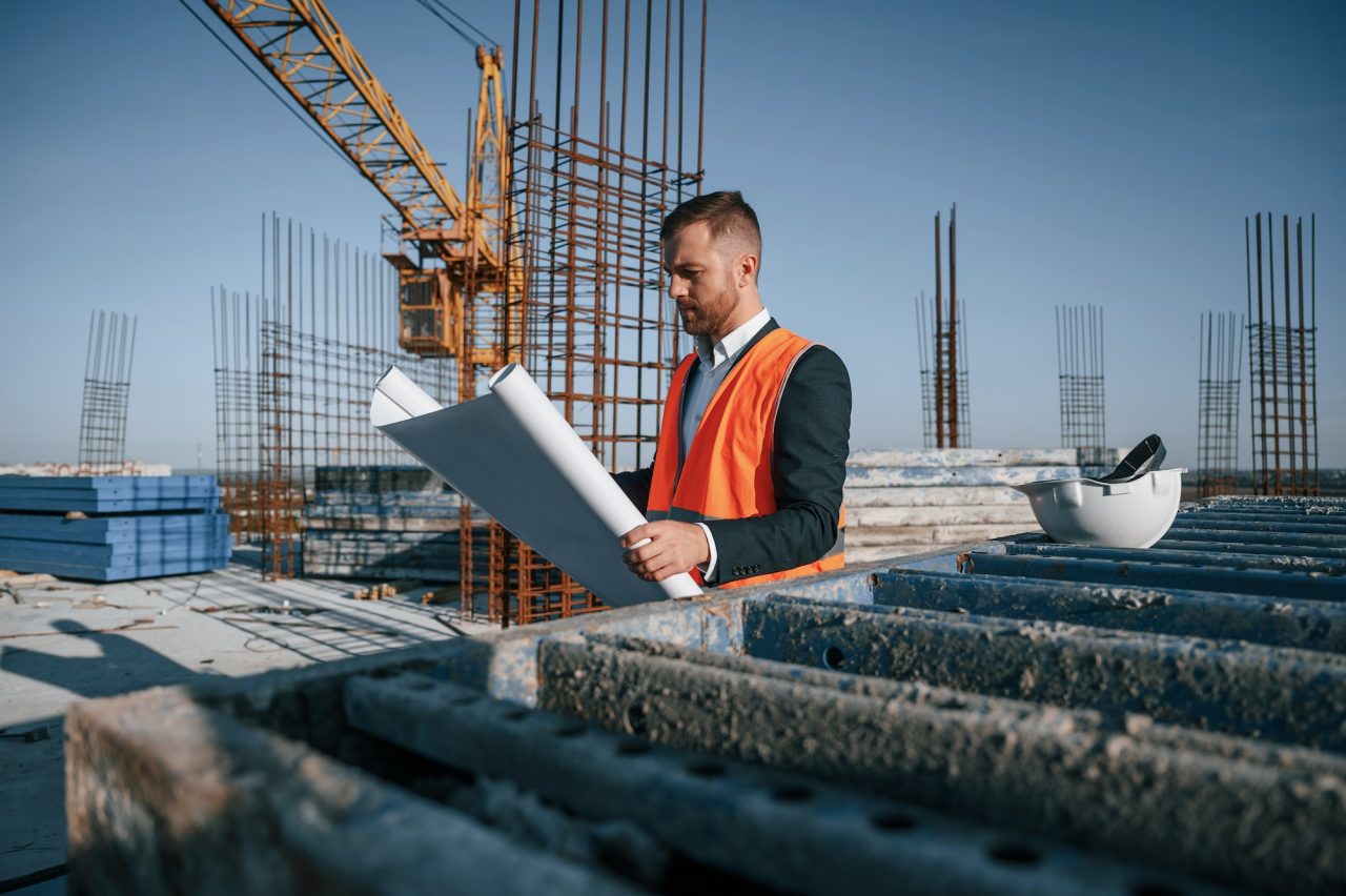 reading the plan man is working on the construction site at daytime.jpg